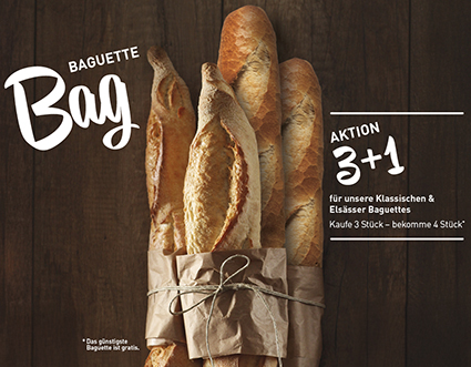 4 Baguettstangen in Papier mit Schleifen eingewickelt